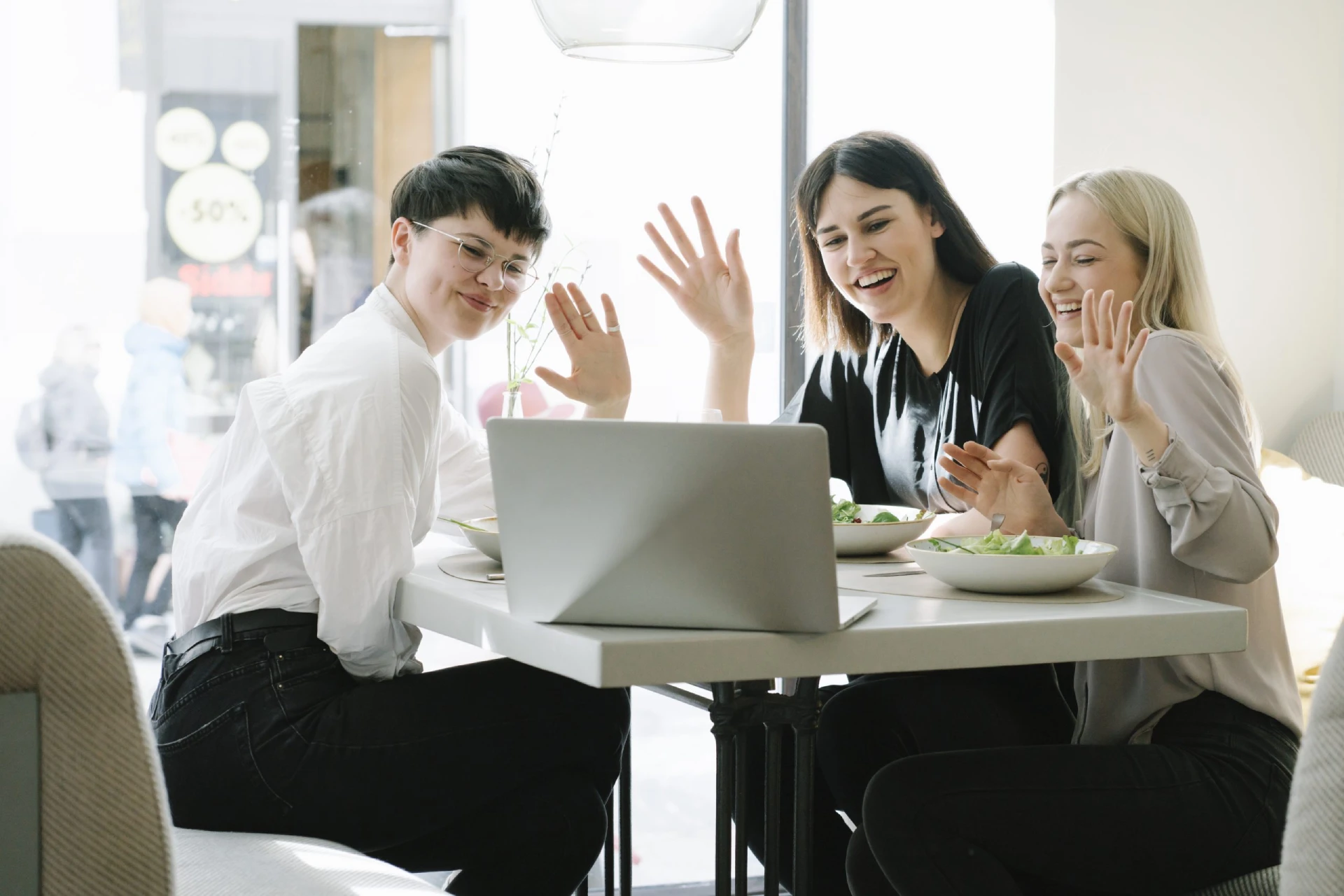 friends-having-a-video-conference-in-a-restaurant-2022-12-16-22-16-43-utc-scaled